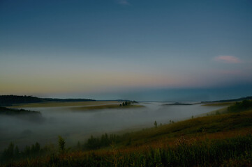 A plane sitting on top of a grass covered field