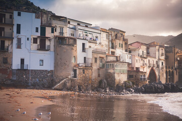 Fototapeta na wymiar Walls and waterfront houses of Cefalu, Sicily, Italy