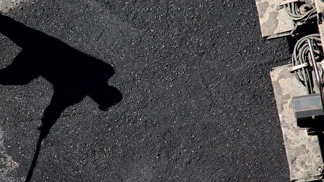 Special equipment pavers and workers lay new asphalt mix on the road. Road repair industry