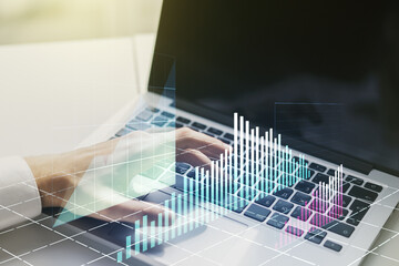 Double exposure of abstract creative financial chart with hand typing on computer keyboard on background, research and strategy concept