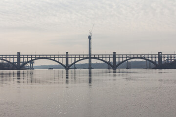 Fototapeta na wymiar View of the Preobragensky Bridge in Zaporizhzhia in the morning. Ukraine