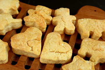 Closeup of Fresh Baked Homemade Heart Shaped Butter Cookies on Wooden Breadboard