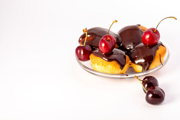 Homemade cupcakes with cherries and chocolate. Classic dessert.