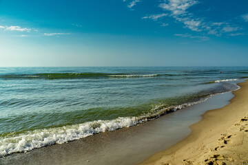 Sea view from tropical beach with sunny sky.