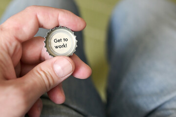 A bottle cap and the words, Get to work!