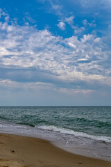Fototapeta na wymiar Relaxing seascape with wide horizon of the sky and the sea