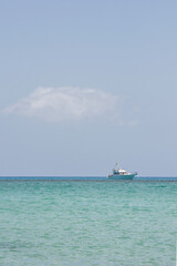 Seascape with a calm sea, a dive boat and blue sky looking from the Isla Los Lobos . Space left for copy text