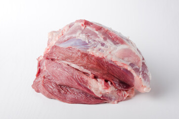 Closeup of raw pork ham on the white background.Fresh meat as an ingredient for cooking
