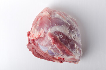 Top view of raw pork ham on th white background.Fresh and juicy meat