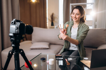 Recording a new vlog for channel. Caucasian beautiful girl blogger tells her subscribers about her...