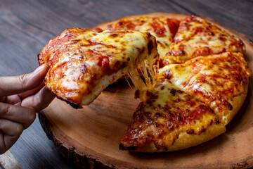 pizza on a wooden plate