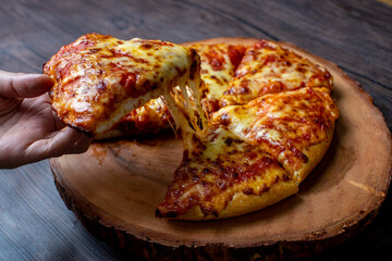 pizza on a wooden plate