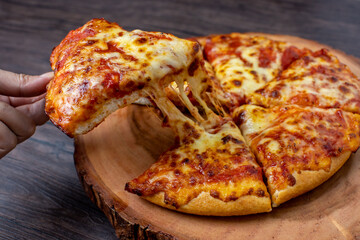 pizza on a wooden plate