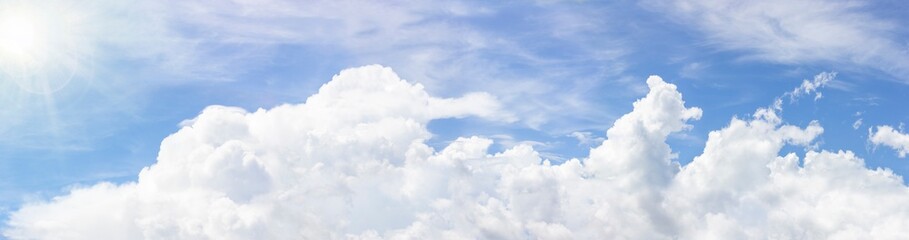 Naklejka na ściany i meble In sunny summer, huge clouds float on sky.