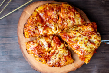 pizza on a wooden plate