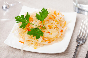 Tasty sauerkraut with parsley. Traditional russian dish - obrazy, fototapety, plakaty