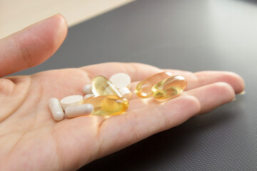 In the palm of your hand, capsules and tablets. Nutritional supplements are the key to health.