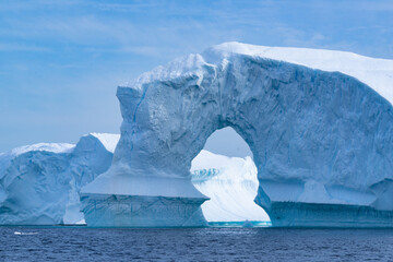 Huge iceberg with archway in Antarctica