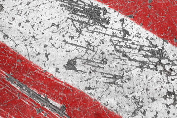 Old red and white painted asphalt texture