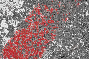Old red and white painted asphalt texture