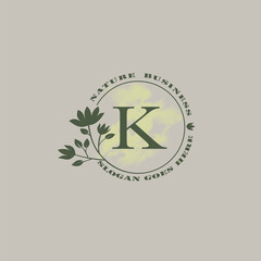 Circle nature tree K letter logo with green leaves in circle line shape for Initial business style with botanical leaf elements vector design.