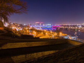 View from the Belgrade fortress Kalemegdan on the river Sava and the city of Belgrade illuminated by night lighting.