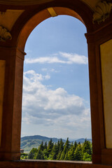 The hills around Bologna as seen through an arch of the "Madonna di San Luca" sanctuary