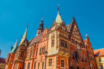 Fototapeta na wymiar WROCLAW,POLAND. Architectural details of Gothic Old Town Hall on Market Squar In Sunny Day. Wroclaw town hall in sunny day. Rathaus