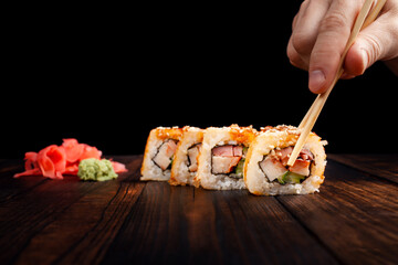 Japan sushi rolls isolated on black background
