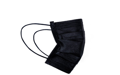 Black surgical or medical face mask isolated on white background. Surgical face mask for...