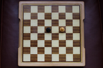 Two chess pieces exercising social distance. Conceptual photography. Covid19