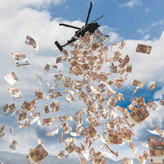 helicopter flies over a city and distributes money euro.