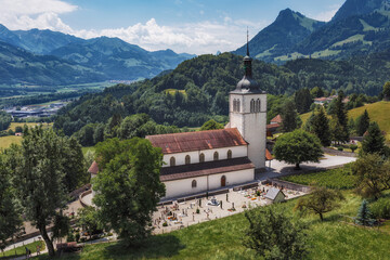 Fototapeta na wymiar The Eglise Saint Theodule and Saane valley - Gruyeres, Switzerland