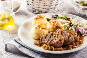 Braised pork loins with onion sauce