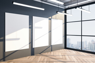 Office interior with three empty billboards on gray wall