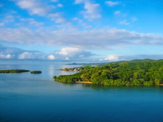 An aerial view of a tropical beach in Roatan Honduras
