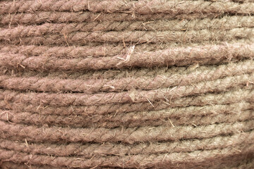 Natural hemp rope, hemp fiber woven into a thick thread closeup textured effect. Natural plant material. Jute rope. texture background for design.