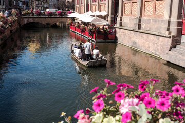 The streets of Colmar in Alsace, France include a navigable canal through the city center