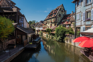 Fototapeta na wymiar The streets of Colmar in Alsace, France include a navigable canal through the city center