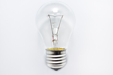incandescent bulb lies on a white background
