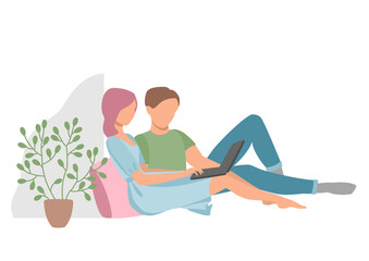 A man and a woman at home with a laptop.