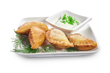 Chebureks on a white plate isolated on a white background