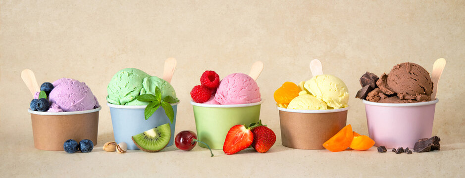 Various colorful ice cream sorts with fruits
