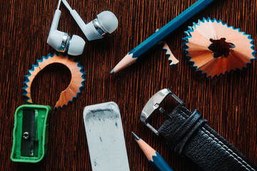 Flat lay shot of pencil and other stationary items on the table 