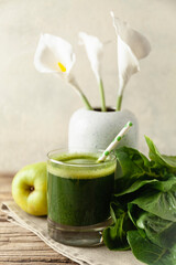 Healthy green smoothie on vintage wooden table. Fresh detox nutrient.