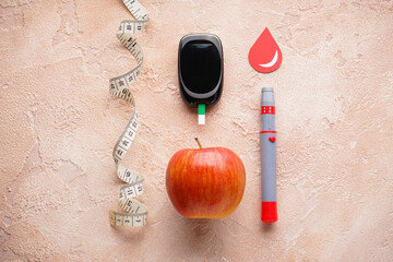Digital glucometer, lancet pen, fruits and fitness centimeter on beige background, flat lay. Diabetes concept.