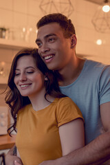 Fototapeta premium happy multiracial couple smiling at home