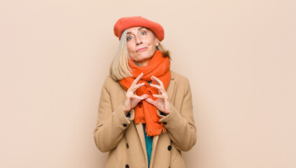 senior or middle age pretty woman scheming and conspiring, thinking devious tricks and cheats,...