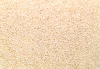 Basmati white rice solid texture. Top view close-up on raw rice grains. Healthy food concept