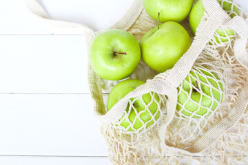 Package-free shopping. Eco friendly bag with apples. Zero waste